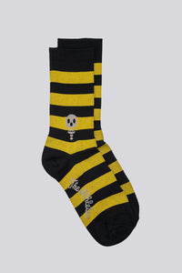black and yellow striped socks with a skull on either side of the sock