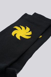 black socks with yellow sun on either side for running or cycling
