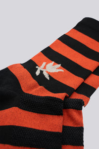 Striped black and red socks for running and cycling with a grey rose on either side
