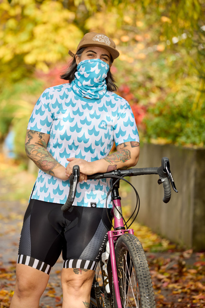 The Women's Mustache Tech Tee is a short-sleeve, moisture-wicking shirt designed for mountain biking, running, or road cycling. Made in the USA by Endo Customs, this versatile performance top adapts seamlessly to your ride or run. Constructed from lightweight, breathable Italian fabric, it features a split side seam at the hem to accommodate lower body movement