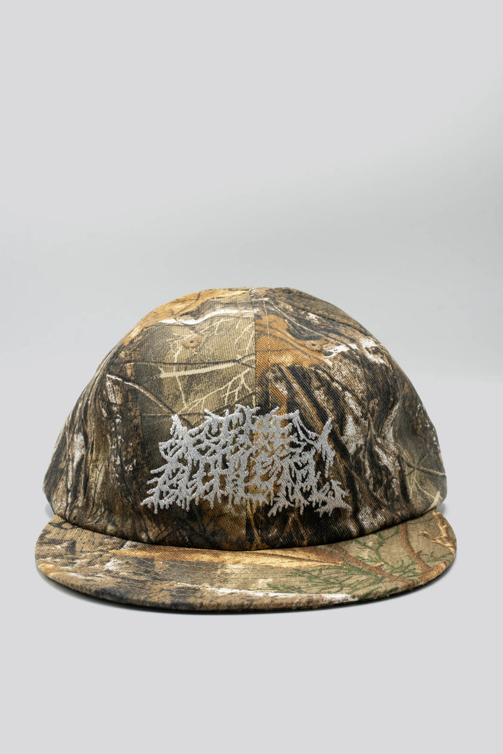 The Realtree Realness Cap is a versatile, unstructured 6-panel hat featuring a unique camo pattern that varies slightly with each cap, adding individuality to your gear. Designed in collaboration with Kyle Kelley, it includes a soft, regular-length bill and no top button, ensuring comfort under a helmet. Crafted in the USA, this hat is perfect for everyday wear and is easily packable for on-the-go adventures