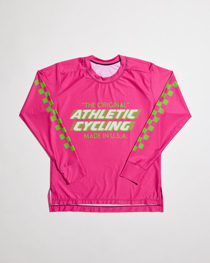 The Women's SUPER TUFF "The Original" Tech Shirt is a long-sleeve, moisture-wicking top designed for mountain biking, running, or road cycling. Made in the USA by Endo Customs, this versatile performance shirt offers comfort and durability for active women