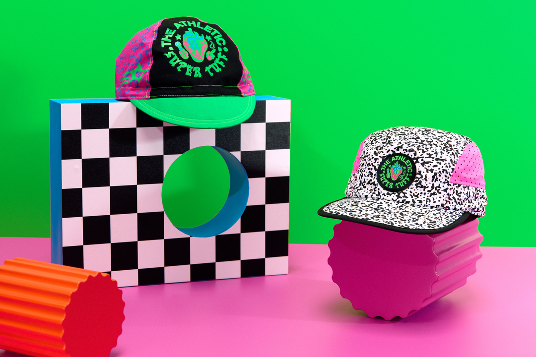 The Athletic Super Tuff Strawberry Cycling Cap is a vibrant, unstructured 3-panel cap featuring a bold strawberry design. Crafted in the Portland, OR, by Double Darn, this cap offers a comfortable fit.