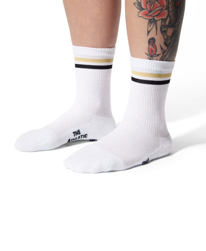 The Tiger Eye Triple Double Crew Socks are designed for versatility and comfort, featuring a fully padded foot and a relaxed ribbed cuff. Ideal for cycling, running, cross-training, or casual wear, these socks are made in the USA from recycled fibers, combining performance with sustainability