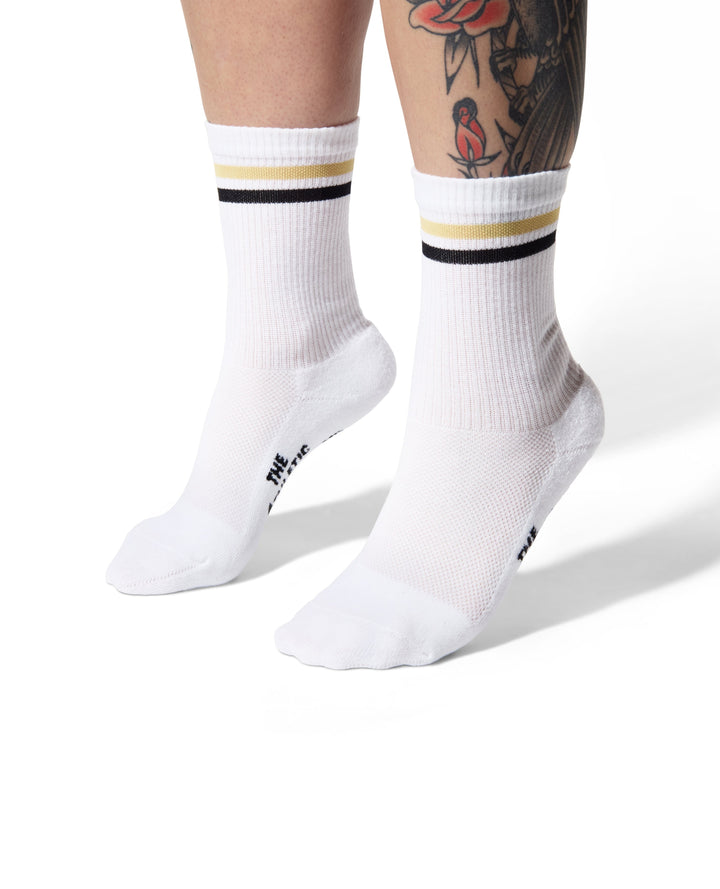The Tiger Eye Triple Double Crew Socks are designed for versatility and comfort, featuring a fully padded foot and a relaxed ribbed cuff. Ideal for cycling, running, cross-training, or casual wear, these socks are made in the USA from recycled fibers, combining performance with sustainability