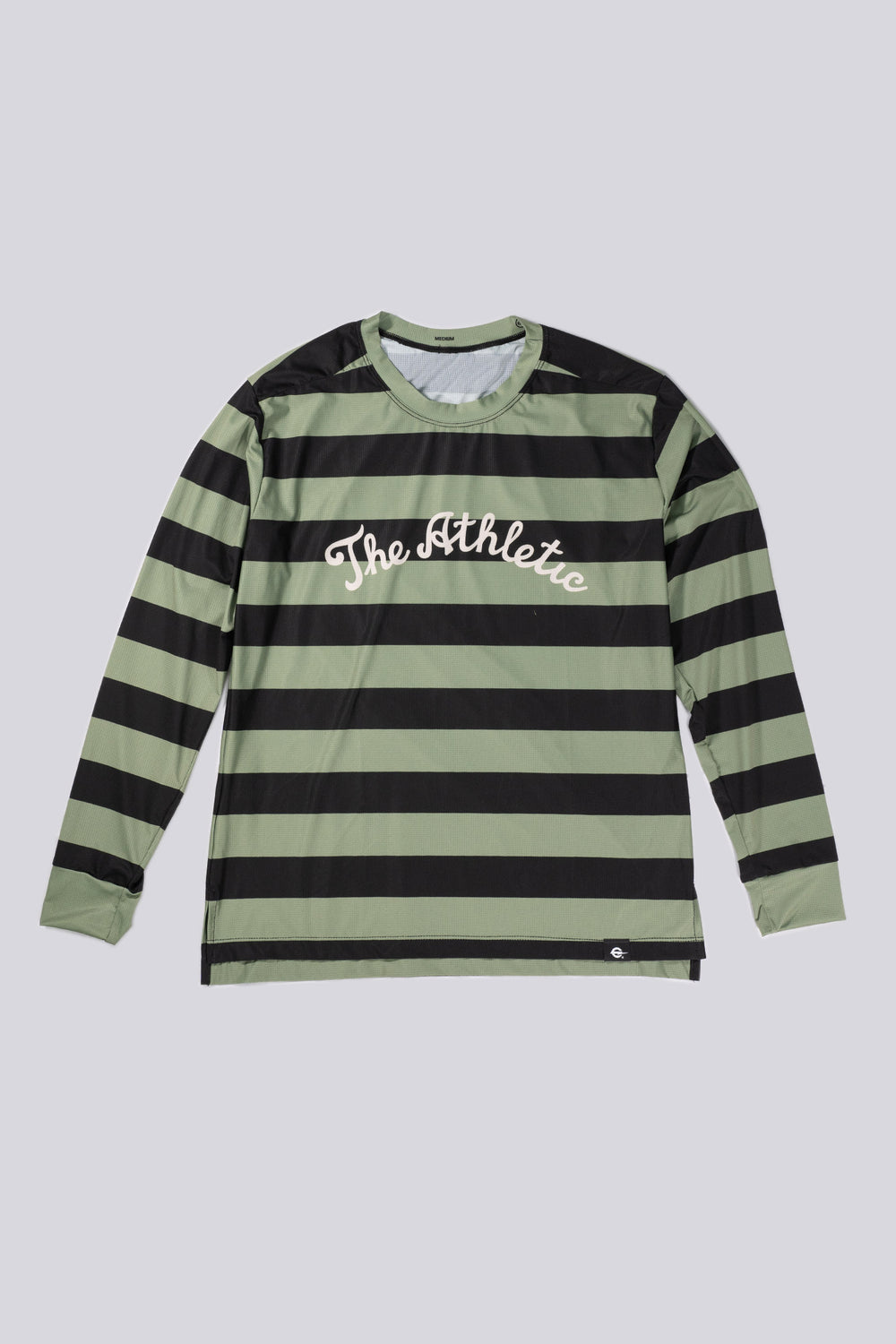 The Men's Stripes Tech Tee is a long-sleeve, moisture-wicking shirt designed for colder runs or gravel rides. Featuring a bold stripe pattern, this limited-run tee pairs well with The Athletic's iceberg socks, Death Palm, or El Sol designs. Crafted in California from Italian fabrics by Endo Customs, it offers both style and performance for active individuals