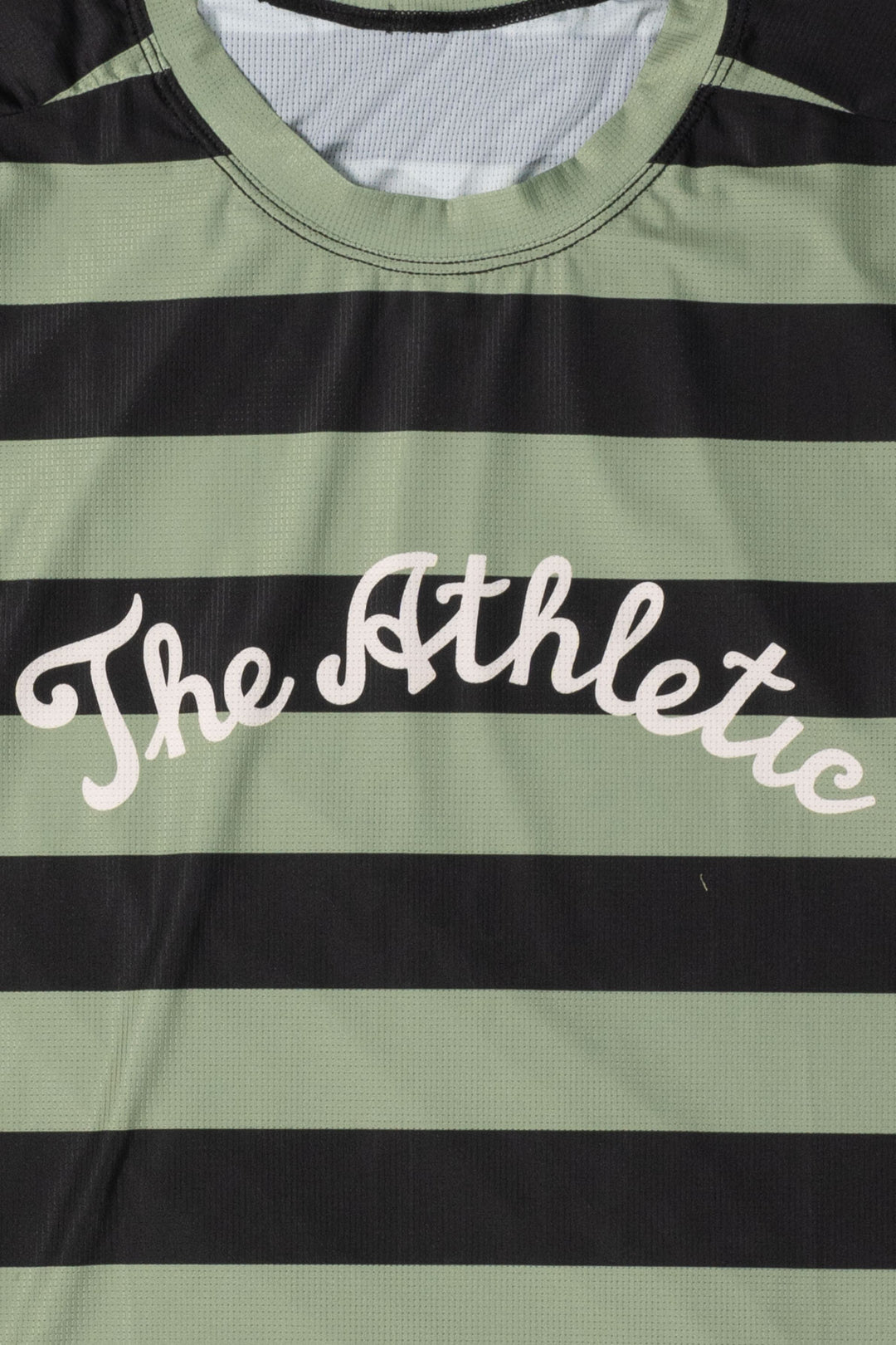 The Men's Stripes Tech Tee is a long-sleeve, moisture-wicking shirt designed for colder runs or gravel rides. Featuring a bold stripe pattern, this limited-run tee pairs well with The Athletic's iceberg socks, Death Palm, or El Sol designs. Crafted in California from Italian fabrics by Endo Customs, it offers both style and performance for active individuals