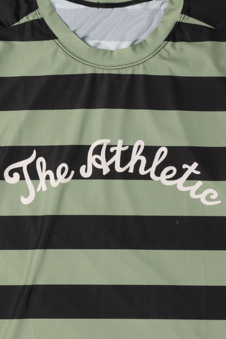 The Men's Stripes Tech Tee is a long-sleeve, moisture-wicking shirt designed for colder runs or gravel rides. Featuring a bold stripe pattern, this limited-run tee pairs well with The Athletic's iceberg socks, Death Palm, or El Sol designs. Crafted in California from Italian fabrics by Endo Customs, it offers both style and performance for active individuals