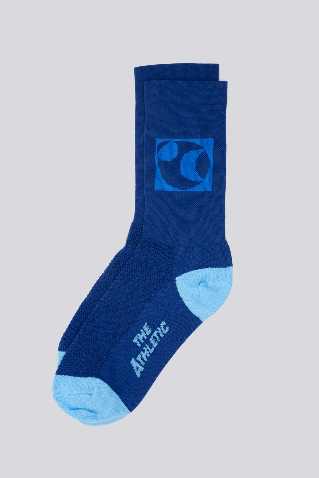 The Moonspin x The Athletic Socks are a collaboration between Moonspin, a women-led mountain biking apparel brand, and The Athletic Community. These socks are available in two colorways: Navy and Blue. Designed to inspire and style your biking adventures, they combine performance with style. Made in the USA with synthetic fibers from post-consumer recycled water bottles, these lightweight socks are breathable, moisture-wicking, and durable—ideal for warm weather cycling and everyday adventures
