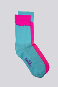 Mismatched socks with teal and pink colors for running or cycling
