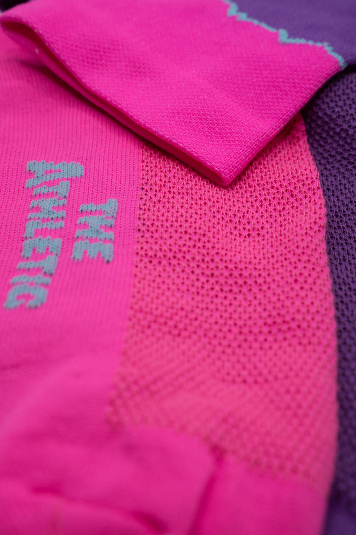 The Elevation Socks – Hood to Coast Edition are designed to commemorate the iconic Hood to Coast Relay, featuring a design that mirrors the elevation profile of the course from Wy'East to the Pacific Ocean. These socks are crafted for versatility, suitable for running, walking, hiking, or cycling. They offer a medium compression cuff for support and are made from a blend of 60% nylon, 39% recycled polyester, and 1% Lycra, ensuring both comfort and durability. Machine washable for easy care