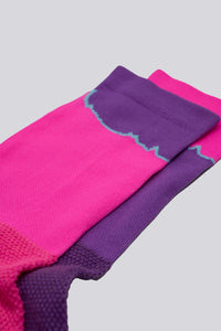 Mismatched socks with pink and purple for running or cycling