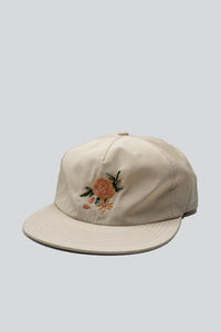 100% nylon hat with an embroidered rose on the front and "The Athletic" embroidered in the back