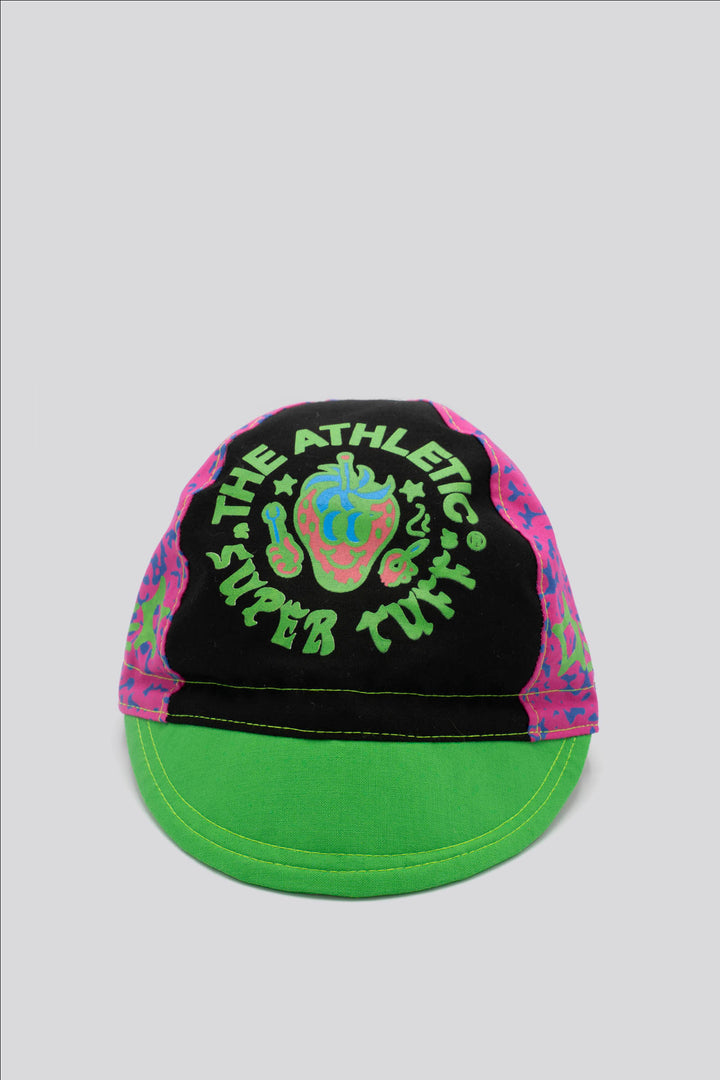 The Athletic Super Tuff Strawberry Cycling Cap is a vibrant, unstructured 3-panel cap featuring a bold strawberry design. Crafted in the Portland, OR, by Double Darn, this cap offers a comfortable fit.