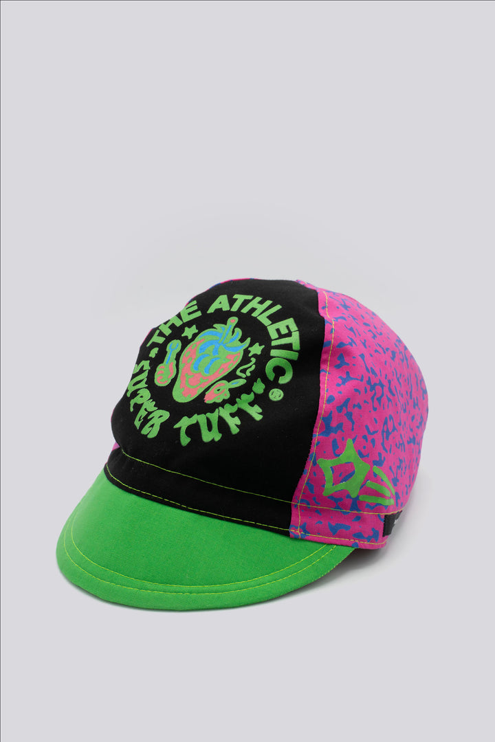 The Athletic Super Tuff Strawberry Cycling Cap is a vibrant, unstructured 3-panel cap featuring a bold strawberry design. Crafted in the Portland, OR, by Double Darn, this cap offers a comfortable fit.