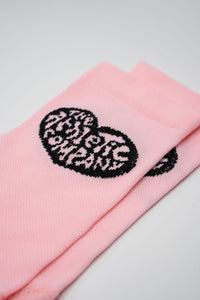 Pink sock with a heart design on either side for running or cycling