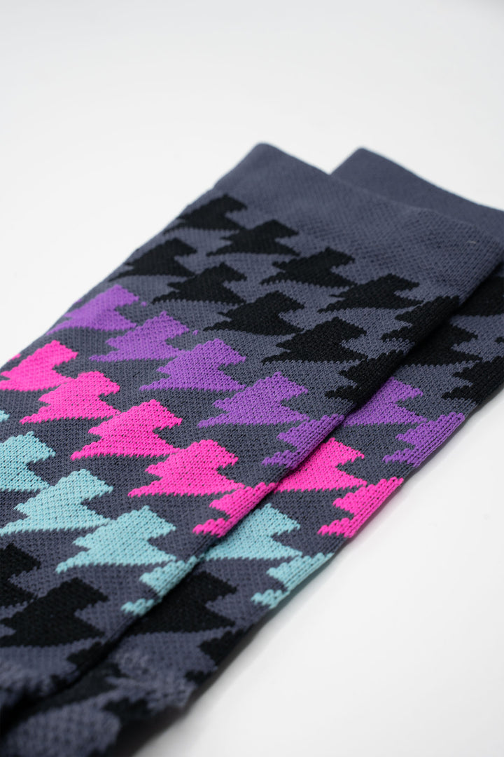 Grey sock with black, purple, teal, pink lightning bolts for running and cycling