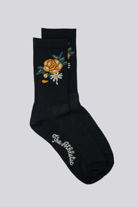 Black sock with a rose design on either side for running and cycling