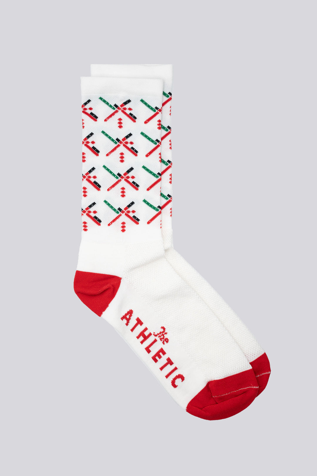 The PDX Futbol Fan Sock Away White features the iconic PDX Airport carpet design in white with red, green, and black accents, inspired by Portland's local soccer team. Ideal for cycling, running, and cross-training, these socks combine style and performance. Made in the USA with recycled fibers, they offer both durability and sustainability