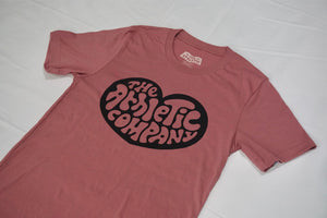 pink tshirt with heart logo saying "the athletic company"