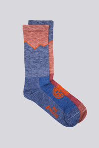 Mismatched red and blue wool socks for running and cycling, a Golden Saddle Cyclery x The Athletic Collab