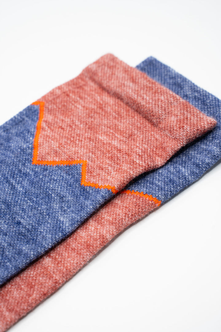 The Athletic x Golden Saddle Cyclery Elevation Lightweight Wool Blend Socks are a collaboration between The Athletic Community and Golden Saddle Cyclery. These mismatched socks feature a lightweight wool and synthetic blend, ensuring your feet stay dry and comfortable whether you're trekking up into the mountains or rocking kicks around town. Made in the United States with love.