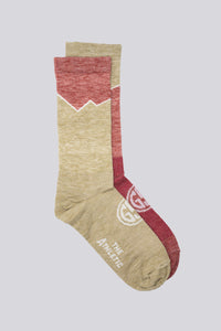 Mismatched red and gold wool socks for running and cycling, a Golden Saddle Cyclery x The Athletic Collab