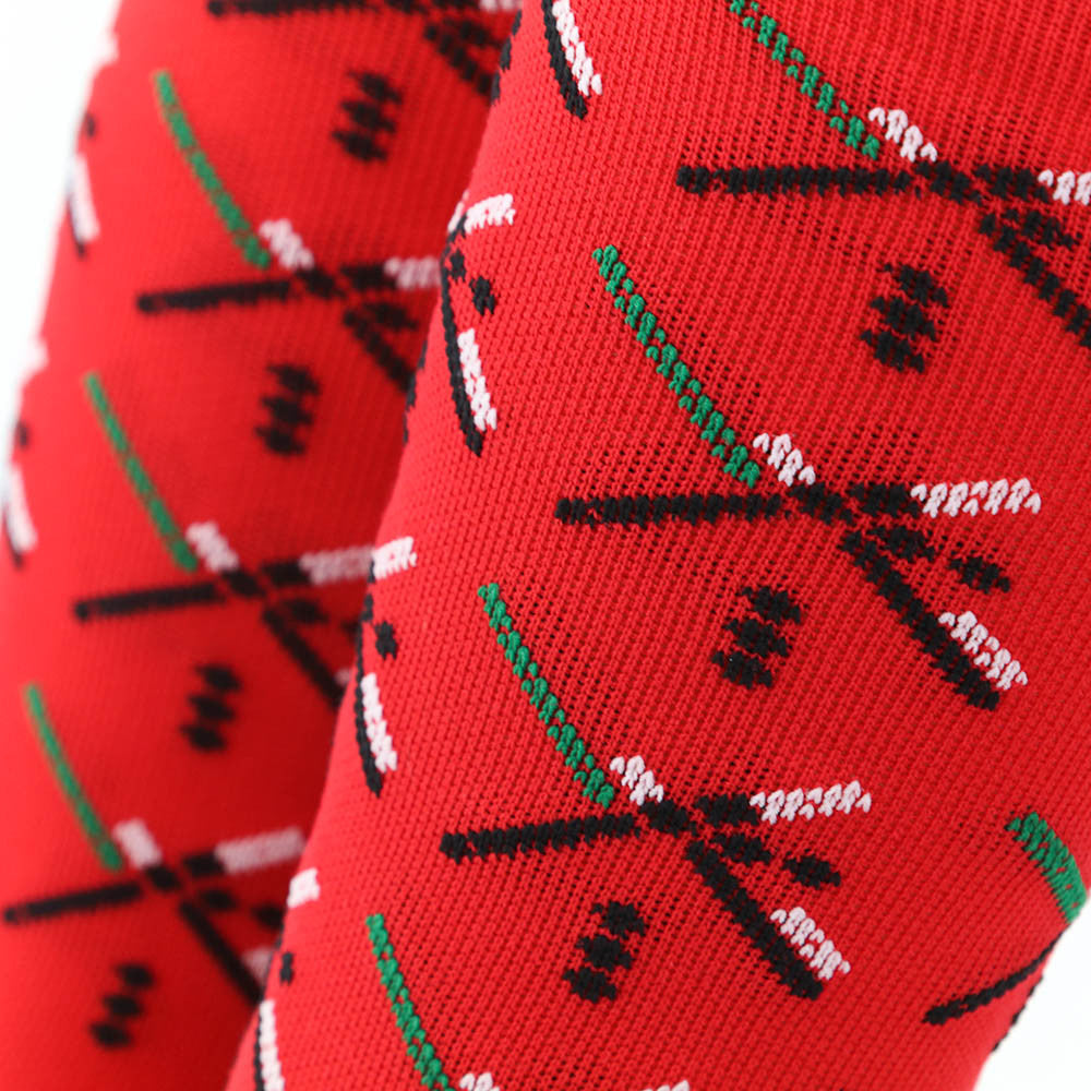 The PDX Futbol Fan Sock Home Red is a tribute to Portland's local soccer team, featuring the iconic PDX Airport carpet design in red, green, and black. Ideal for cycling, running, and cross-training, these socks combine style and performance. Made in the USA with recycled fibers, they offer both durability and sustainability