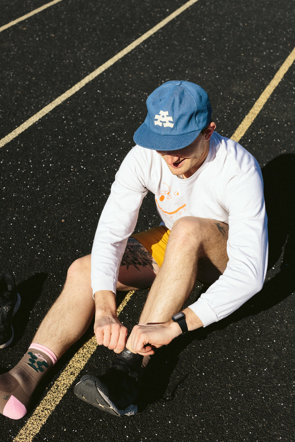 The Athletic Wavy A Denim Dad Hat is a 100% cotton denim cap featuring the embroidered "Wavy A" logo, symbolizing The Athletic's blend of past and future. Designed in collaboration with Young Jerks, this hat offers a timeless, denim aesthetic suitable for various off-bike activities
