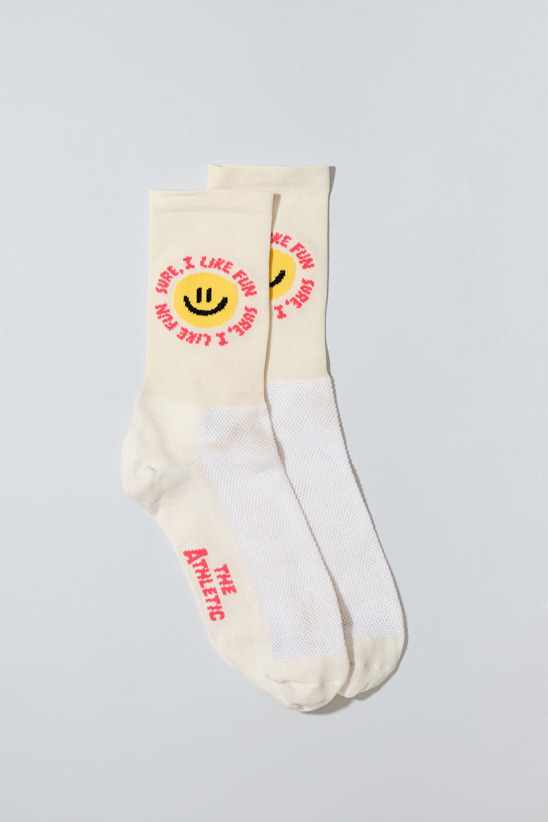 The Sure, I Like Fun Socks feature a playful smiley face design with the caption "Sure, I like fun." Crafted in the USA, these black socks are perfect for cycling, running, and cross-training